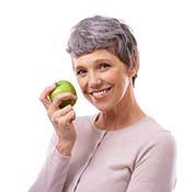 woman holding a green apple 