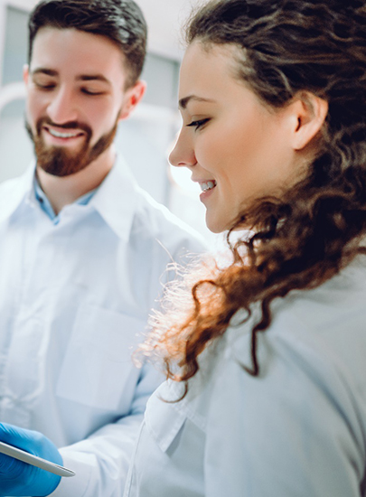 a dentist explaining dental crowns in Chula Vista