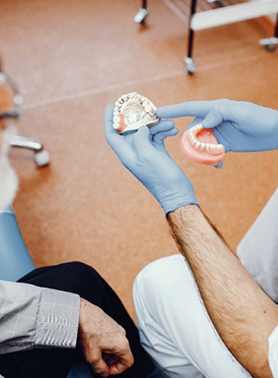 Chula Vista dentist explaining dentures to a patient