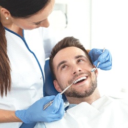 Patient completing checkup with emergency dentist in Chula Vista
