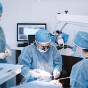 dentists performing dental implant surgery