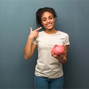 woman with piggy bank pointing to her smile