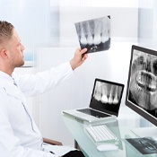 dentist looking at patient X-rays