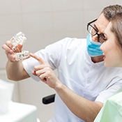 a dentist looking at a patient’s digital impressions