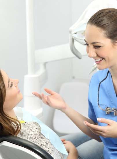 dentist talking to a patient about dental implant care in Chula Vista 
