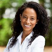 smiling woman in a white collared shirt 