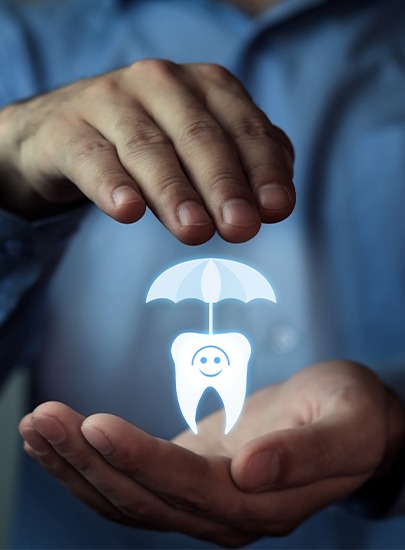 Hand holding an animated tooth under an umbrella