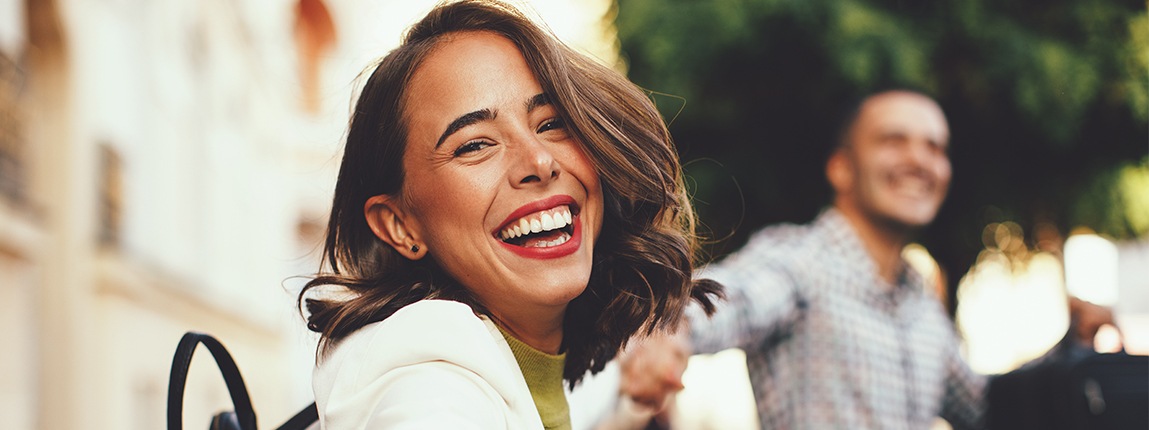 Woman with straight smile after Invisalign