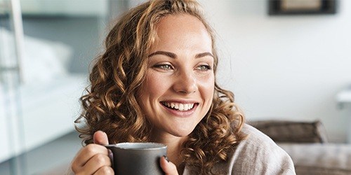 Woman with beautiful smile after cosmetic dentistry