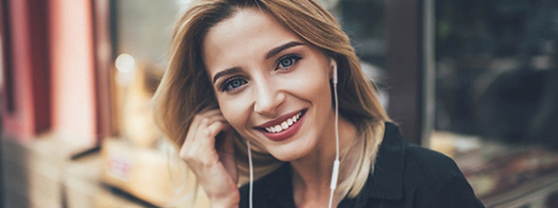 Closeup of woman with white, healthy teeth smiling