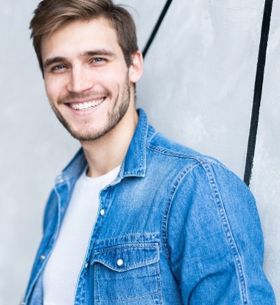 Smiling man in jeans jacket 