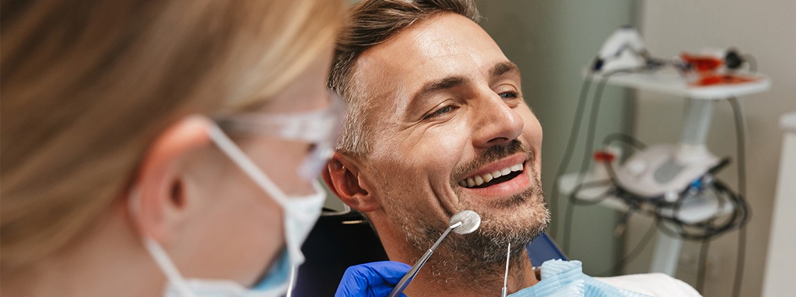 Man receiving dental examination in state of the art dental treatment room