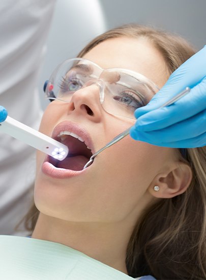 Dentist using intraoral camera to capture images