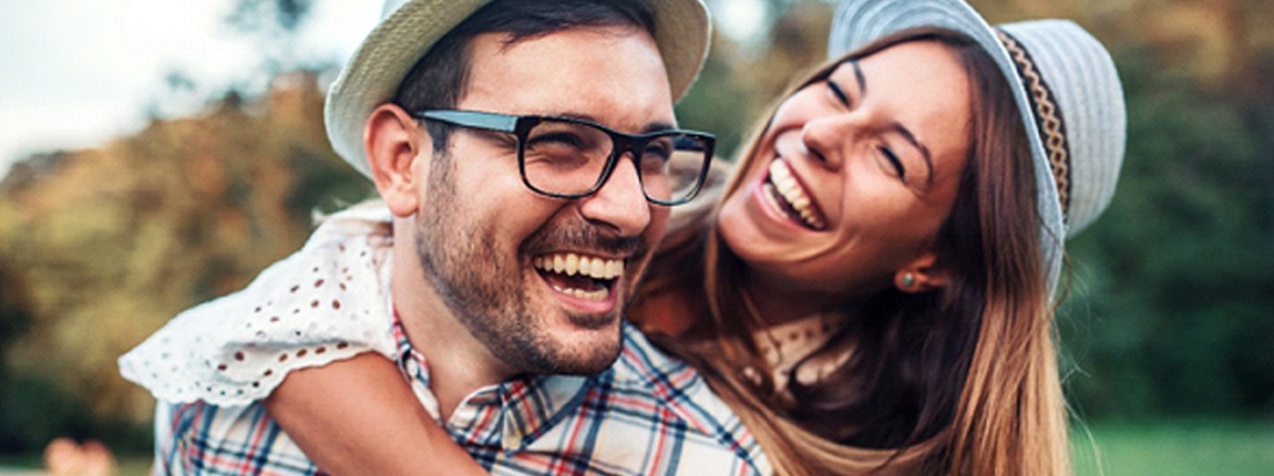 Couple smiling together outside