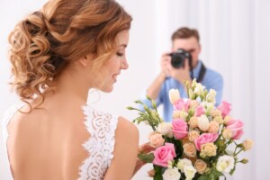 photographer taking a photo of a bride on her wedding day