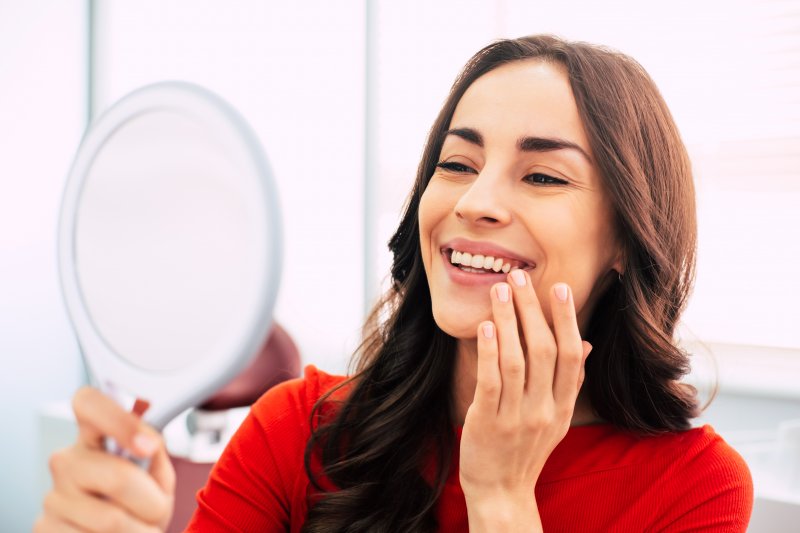 young woman smiling with dental implants