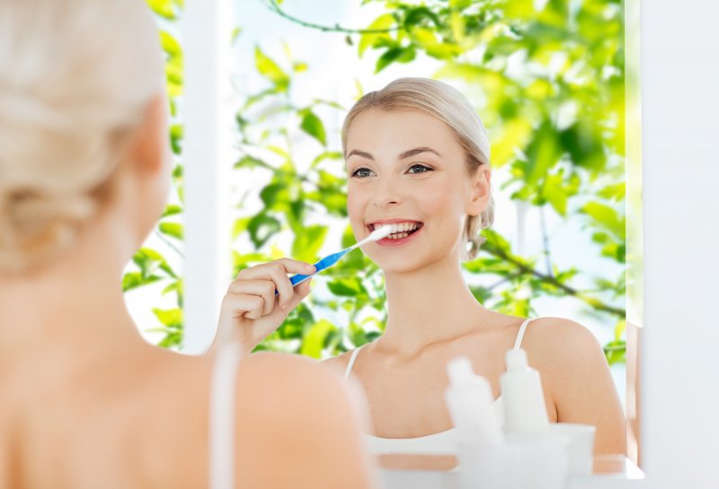 woman cleaning teeth in Chula Vista