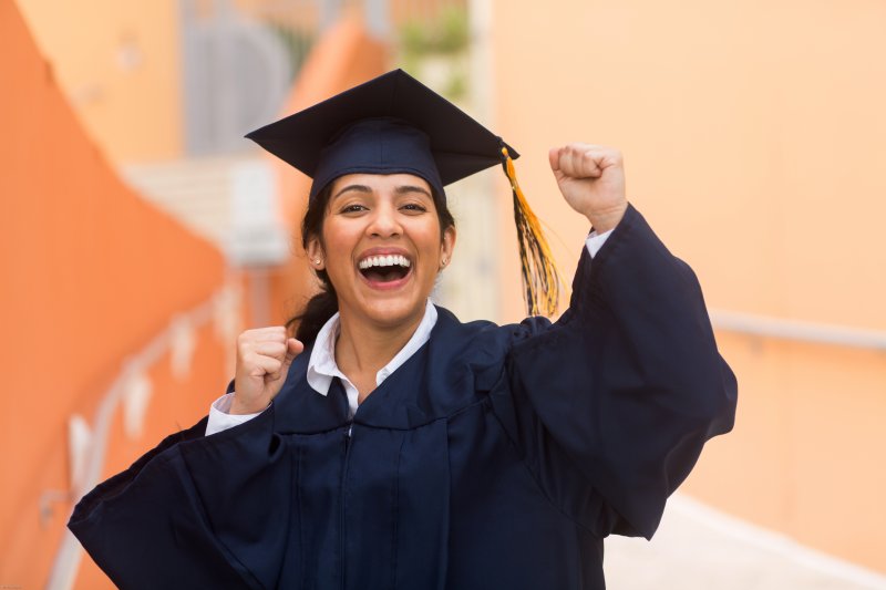 graduating student smiling for the camera