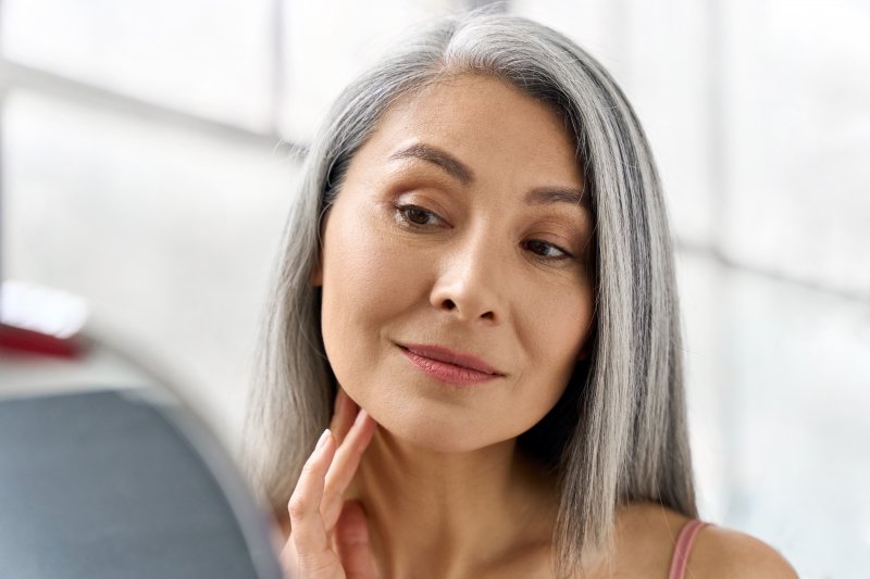 Patient smiling after cosmetic dentistry